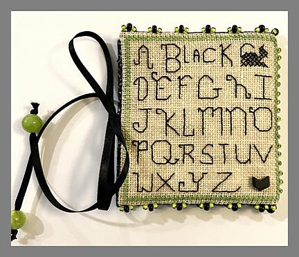A Black Cat Needle Book